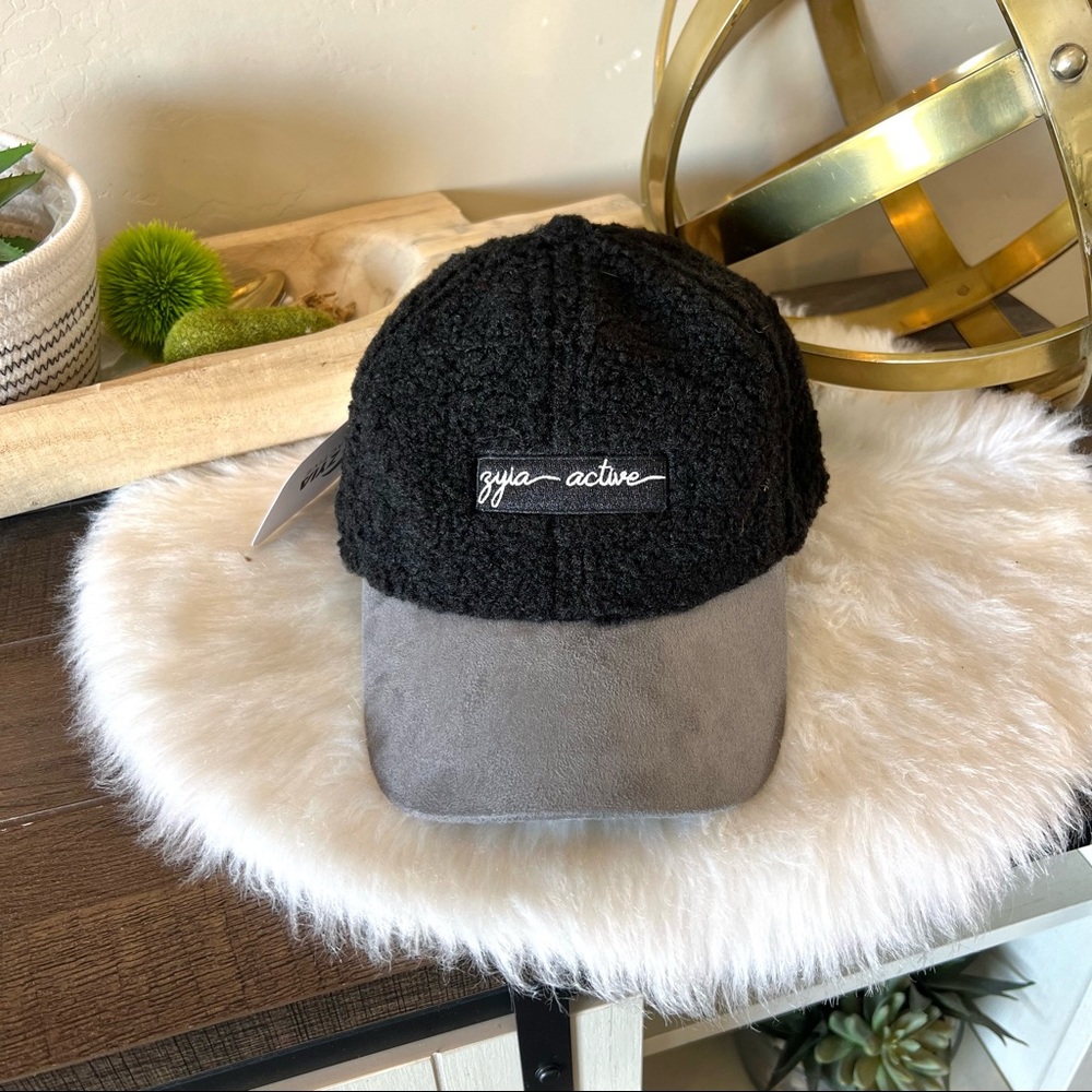 New with tags- ZYIA camel & black sherpa cap hat